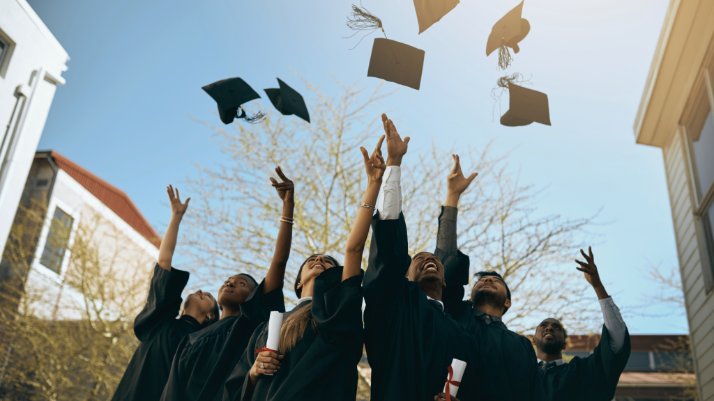Hats being thrown in the air by graduates